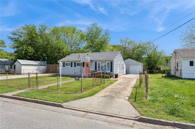 bungalow-style house with fence private yard, an outbuilding, a garage, driveway, and a front lawn