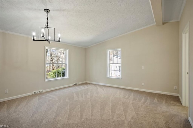carpeted empty room featuring an inviting chandelier, vaulted ceiling, visible vents, ornamental molding, and a textured ceiling