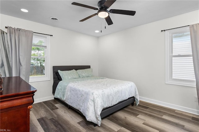 bedroom with recessed lighting, wood finished floors, visible vents, baseboards, and ceiling fan
