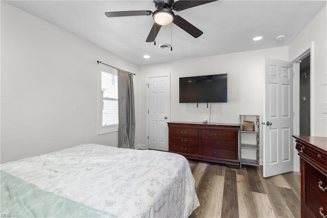 bedroom with recessed lighting, wood finished floors, visible vents, and a ceiling fan