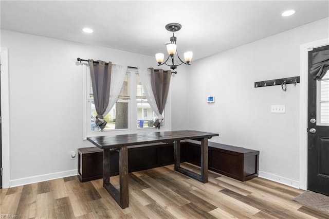 office space featuring recessed lighting, baseboards, a chandelier, and light wood-style flooring