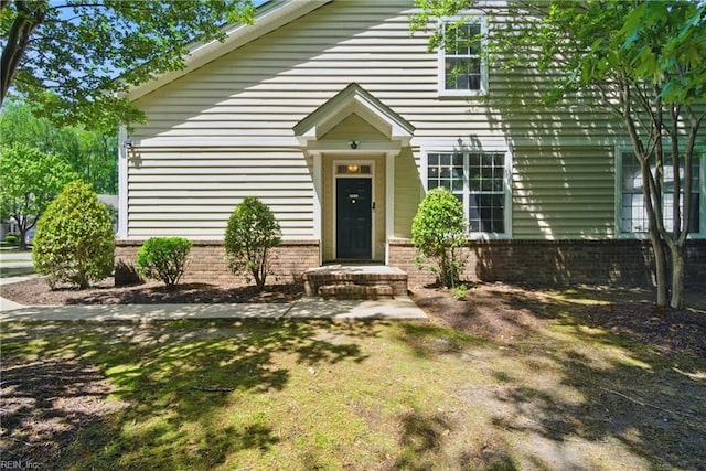 view of front of home with brick siding