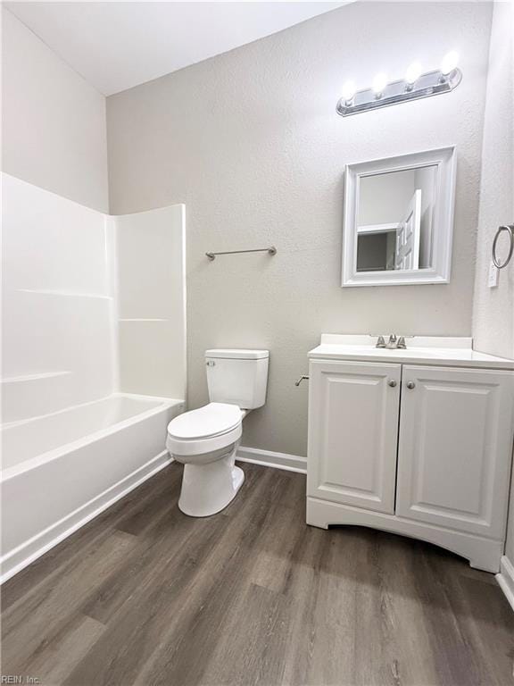 806 Fontaine St Unit B, Franklin, VA 23851 - bathroom with  shower combination, toilet, baseboards, wood finished floors, and vanity