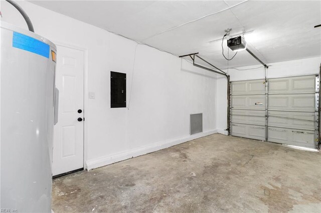garage with refrigerator, electric panel, and a garage door opener