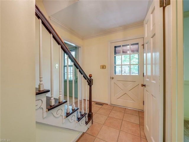 interior space featuring stairs, light tile patterned floors, and crown molding