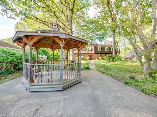 view of home's community featuring a lawn and a gazebo