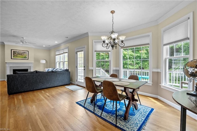 4011 E Providence Rd, Williamsburg, VA 23188 - dining space featuring ornamental molding, light wood-style floors, and a textured ceiling