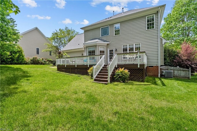 4011 E Providence Rd, Williamsburg, VA 23188 - rear view of house featuring a deck, a yard, and central AC unit