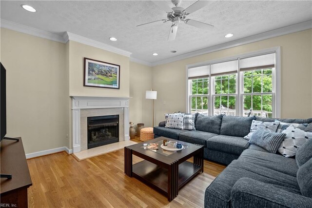 4011 E Providence Rd, Williamsburg, VA 23188 - living area with recessed lighting, light wood-type flooring, a textured ceiling, and crown molding
