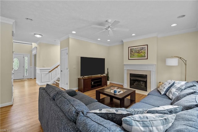 4011 E Providence Rd, Williamsburg, VA 23188 - living area with crown molding, a ceiling fan, a high end fireplace, and light wood-style flooring