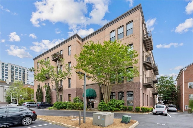 view of property with uncovered parking