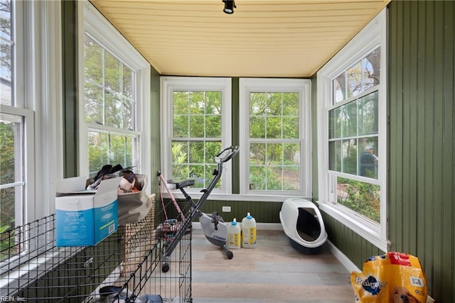 sunroom / solarium with wooden ceiling and wood finished floors
