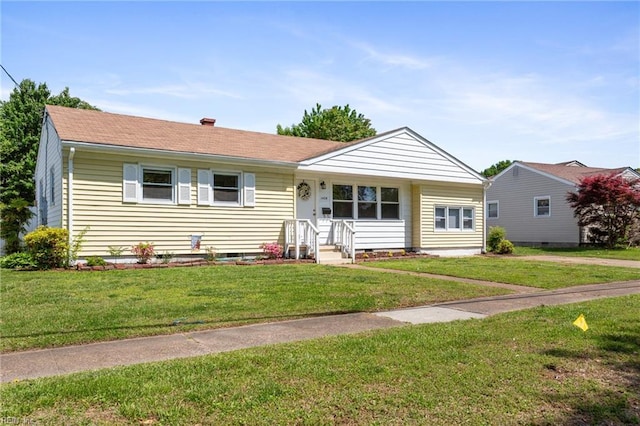 single story home featuring a front lawn
