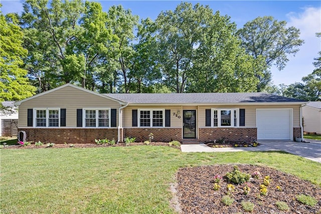 single story home with an attached garage, a front yard, driveway, and brick siding