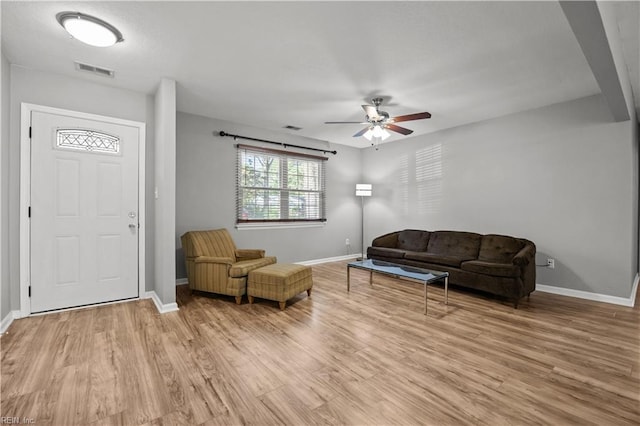 living room featuring visible vents and baseboards