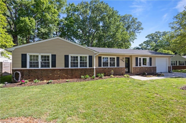 ranch-style house with brick siding, an attached garage, driveway, and a front yard