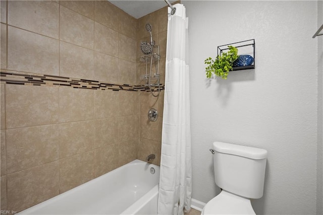 bathroom featuring toilet and shower / bath combo