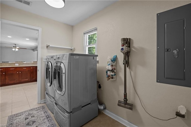 clothes washing area with electric panel, a ceiling fan, laundry area, visible vents, and washing machine and dryer