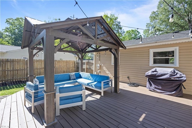 deck featuring a fenced backyard, a gazebo, grilling area, and outdoor lounge area