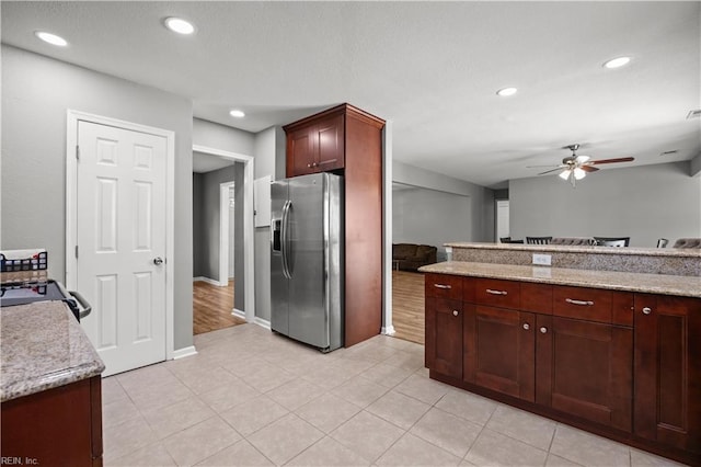 kitchen with recessed lighting, ceiling fan, stainless steel fridge, and light tile patterned flooring