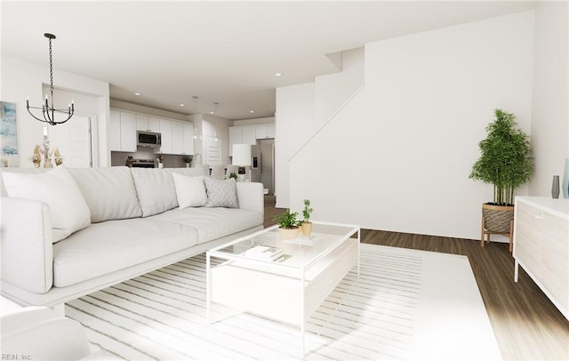 living room featuring an inviting chandelier, recessed lighting, and dark wood-style flooring