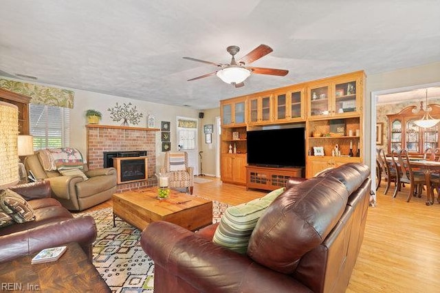 1609 Macgregory Ct, Virginia Beach, VA 23464 - living room with ceiling fan, plenty of natural light, light wood-style flooring, and a fireplace