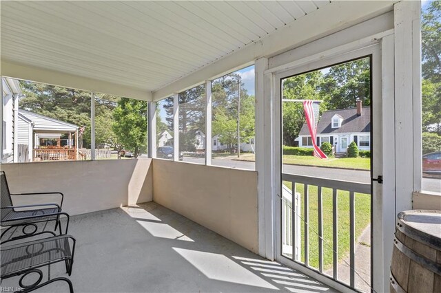 unfurnished sunroom featuring a healthy amount of sunlight