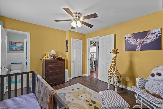 bedroom with wood finished floors, a ceiling fan, and baseboards