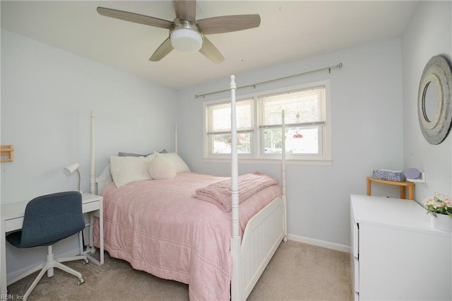bedroom featuring baseboards, a ceiling fan, and light colored carpet