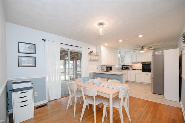 dining area with light wood-style flooring, baseboards, visible vents, recessed lighting, and a ceiling fan