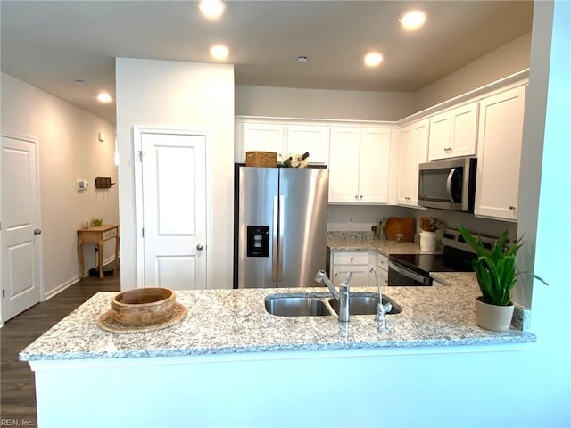 1547 Stanford Ln, Newport News, VA 23608 - kitchen with recessed lighting, light stone countertops, stainless steel appliances, and a sink