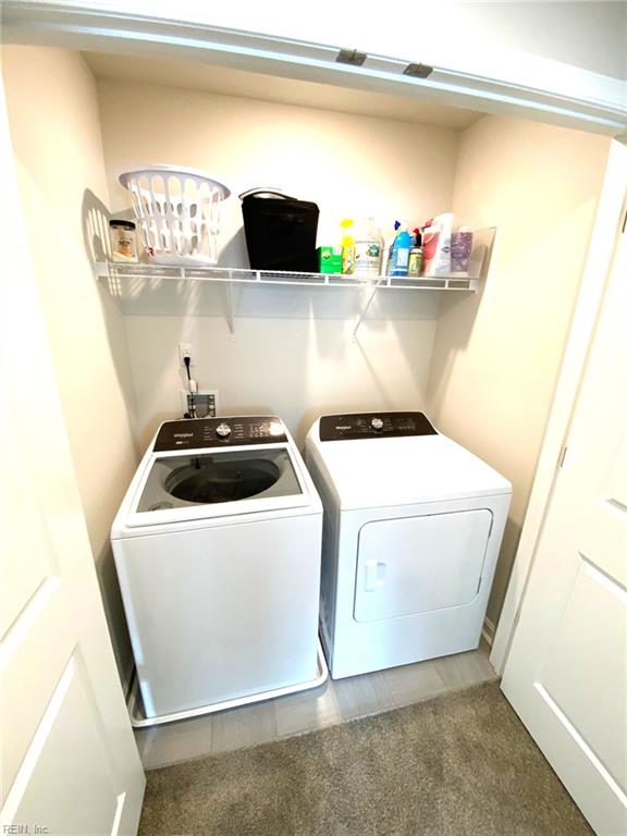 1547 Stanford Ln, Newport News, VA 23608 - washroom with washer and dryer, tile patterned flooring, and laundry area