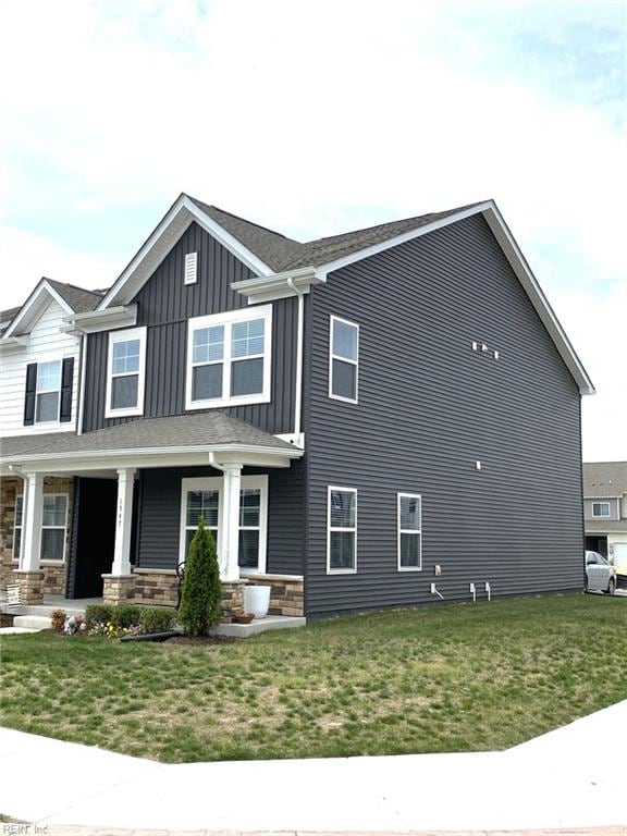 1547 Stanford Ln, Newport News, VA 23608 - exterior space with a yard, board and batten siding, and covered porch