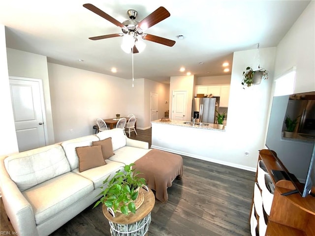 1547 Stanford Ln, Newport News, VA 23608 - living area featuring baseboards, dark wood-style floors, and ceiling fan