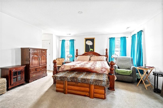 carpeted bedroom featuring multiple windows
