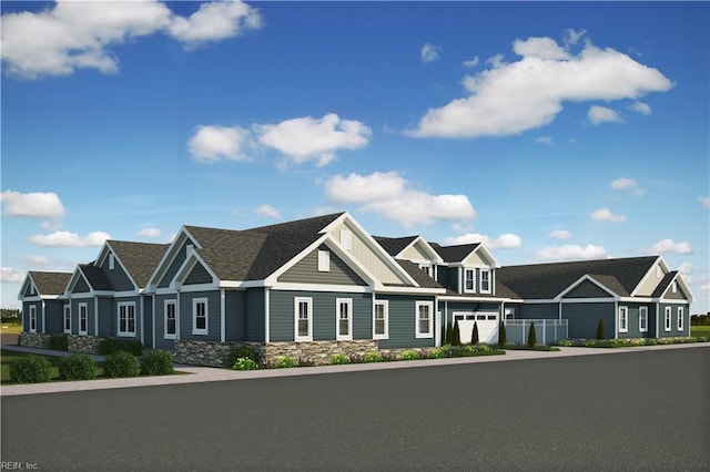 craftsman house featuring roof with shingles