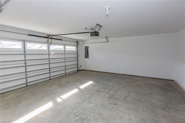 garage with baseboards, a garage door opener, and electric panel
