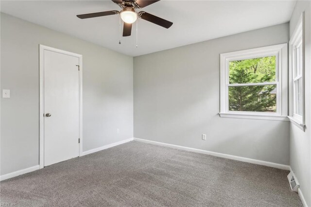 5018 Evelyn Ct, Hampton, VA 23605 - spare room featuring carpet floors, visible vents, a ceiling fan, and baseboards