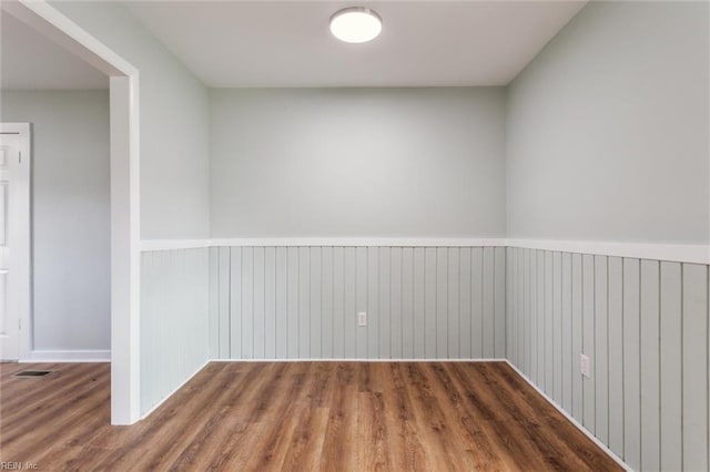 5018 Evelyn Ct, Hampton, VA 23605 - unfurnished room with wainscoting and wood finished floors