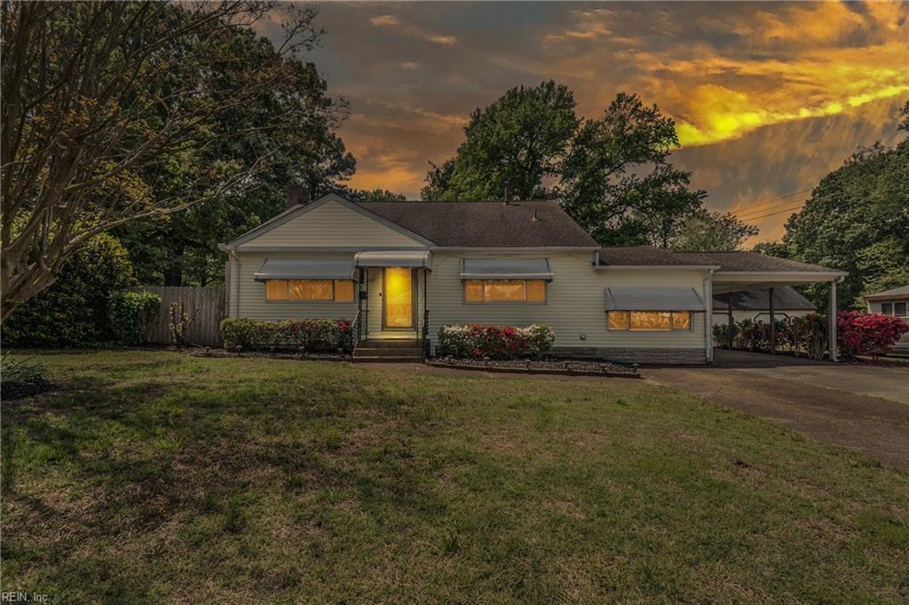 861 Romney Ln, Virginia Beach, VA 23455 - view of front of house with an attached carport, a front yard, aphalt driveway, and fence