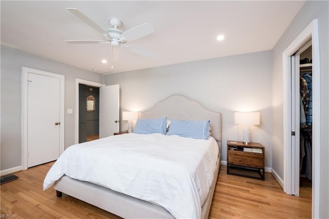 bedroom with baseboards, recessed lighting, ceiling fan, and light wood-style floors