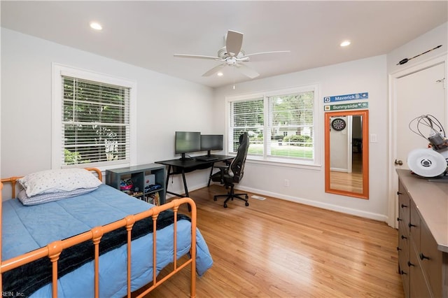 bedroom with ceiling fan, recessed lighting, light wood-style flooring, and baseboards