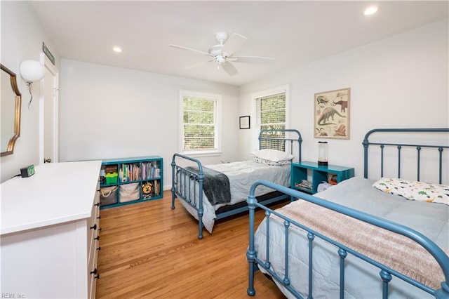 bedroom with recessed lighting, light wood finished floors, ceiling fan, and visible vents