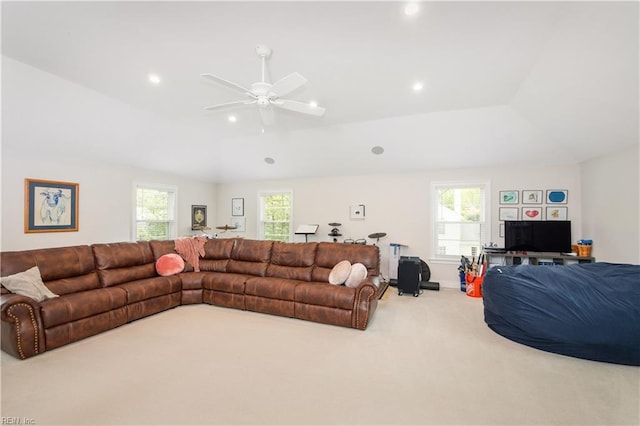 carpeted living area featuring a ceiling fan, a healthy amount of sunlight, lofted ceiling, and recessed lighting