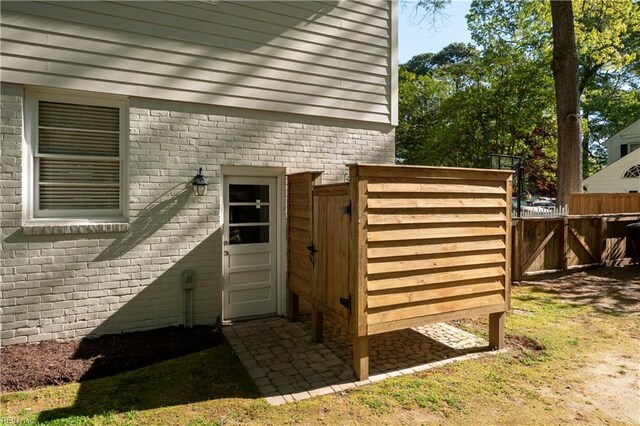 view of outdoor structure featuring fence