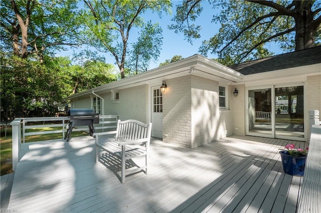 wooden terrace featuring area for grilling