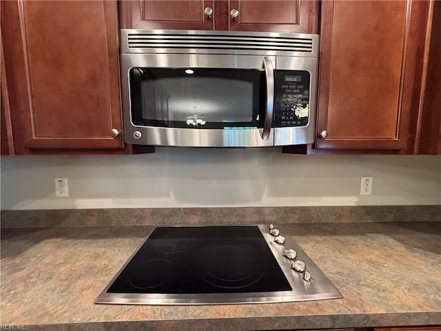 35 Miles Cary Mews, Hampton, VA 23669 - room details featuring stainless steel microwave, dark countertops, and electric cooktop