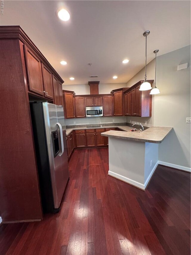 35 Miles Cary Mews, Hampton, VA 23669 - kitchen featuring dark wood-style flooring, a peninsula, appliances with stainless steel finishes, and light countertops