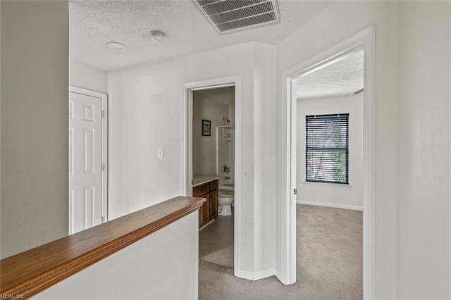 3605 Shell Rd, Hampton, VA 23661 - hall featuring baseboards, visible vents, a textured ceiling, and carpet flooring