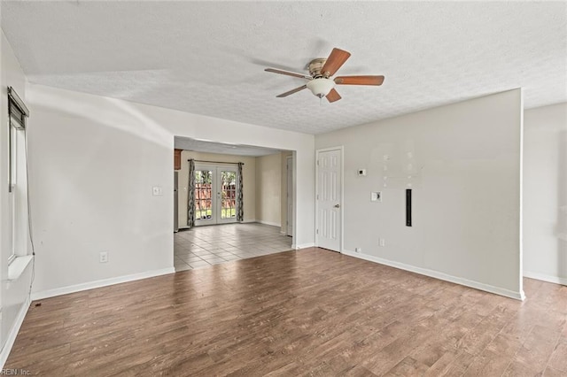 3605 Shell Rd, Hampton, VA 23661 - empty room featuring a textured ceiling, french doors, wood finished floors, and a ceiling fan